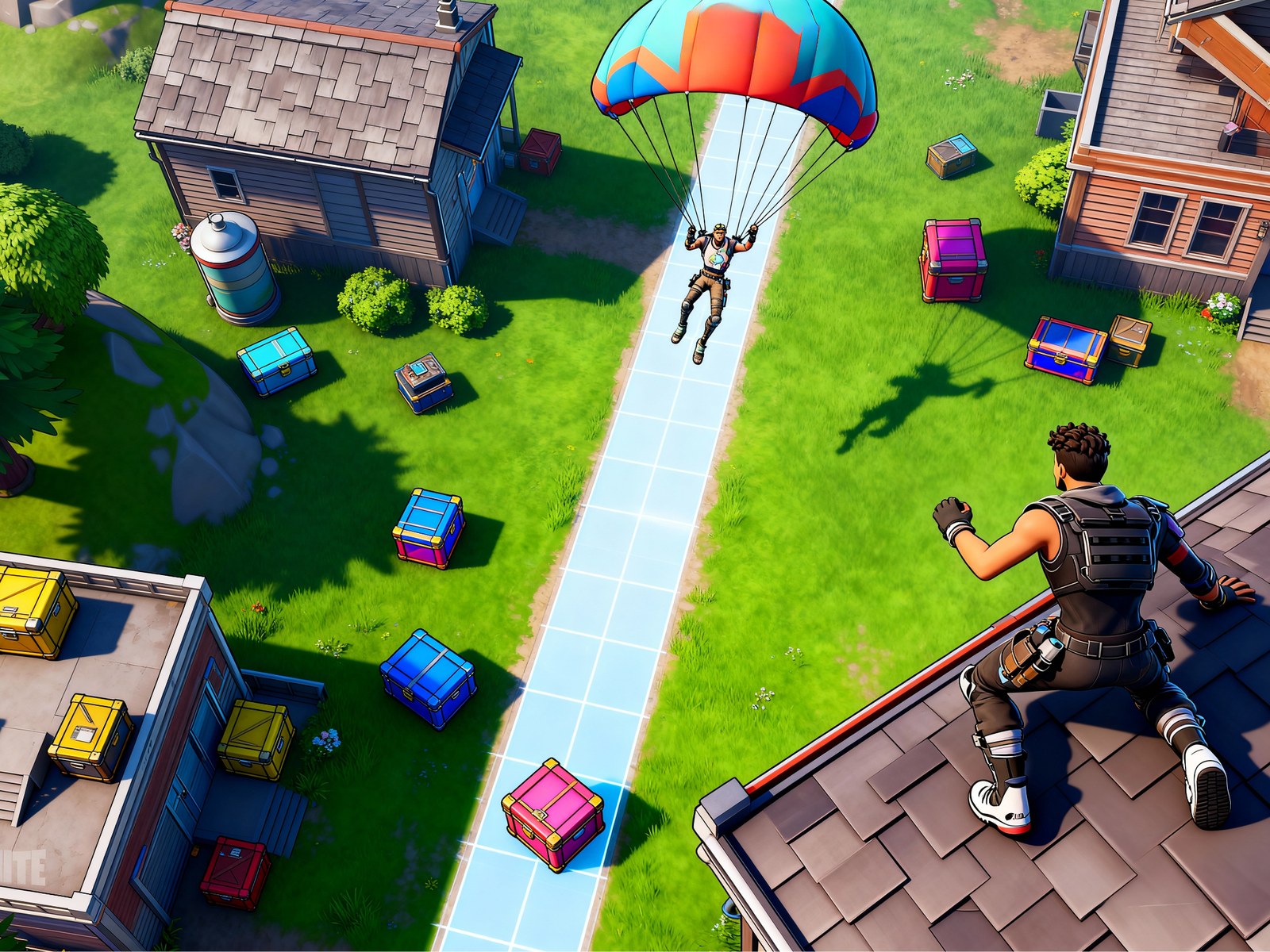 Fortnite player gliding toward a rooftop landing spot surrounded by loot